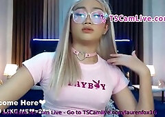 Cheerful ladyboy has fun with her pink anal dildo on a live webcam show