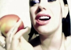 My lips are painted with a nice-looking pink lipstick. I eat a crunchy and soaked apple. I bite throughout the red skin, revealing the crisp white fle