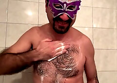 Earl enjoys a steamy bath while soaping up in the motel