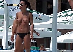 An adorable nudist teens playing volleyball at nude beach