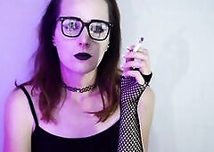 Darksome gothic angel smokes during the time that wearing fishnet nylons. That babe takes slow, seductive drags with her ebony lipstick and fishnets o