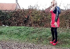 Crossdresser pissing outdoors masturbating by roadside