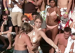 Blonde girls unleash wild tit action at a crowded spring break beach party