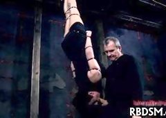 Babe in latex suit gets punished