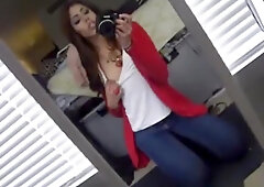 girl tapes herself in the mirror, while masturbating with a dildo.