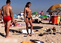 Beach voyeur captures beautiful amateur babes sunbathing