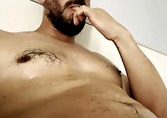 Well-endowed Latino with a large, curved cock enjoys gay cum swallowing action